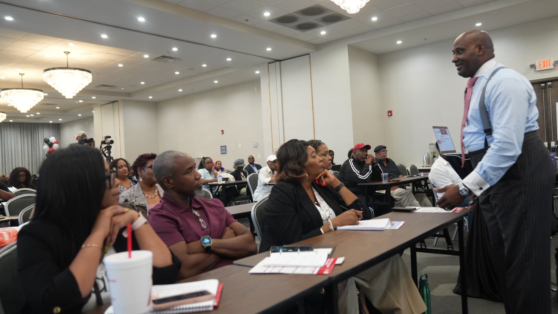 Executive real estate investing education — Luther Ragsdale training room with serious investors